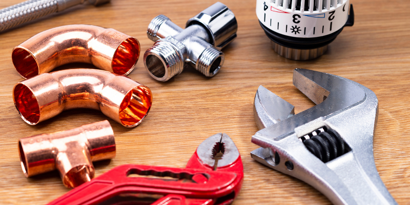 basic plumbing tools on a table. 