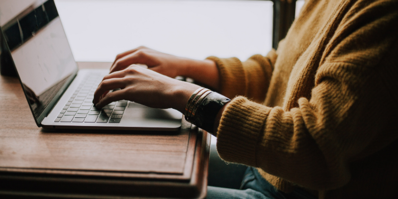 Woman managing her business on her laptop.