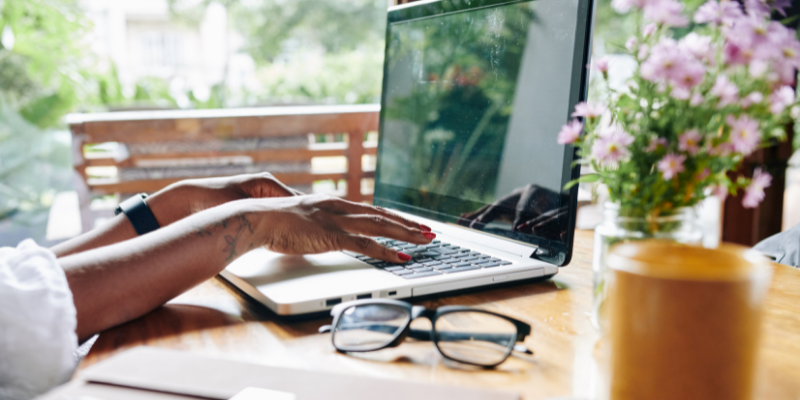 Woman on her laptop working remotely.