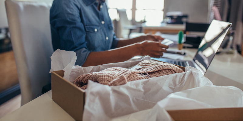 Business owner packing an order. 