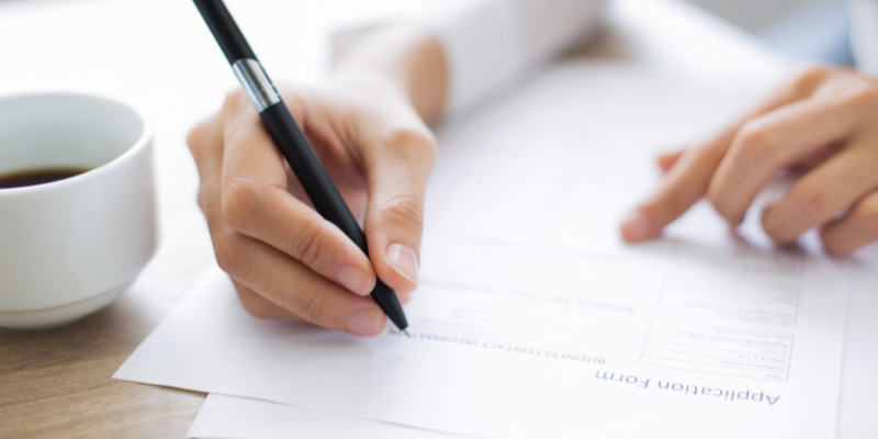 business owner filling out application to register her business.