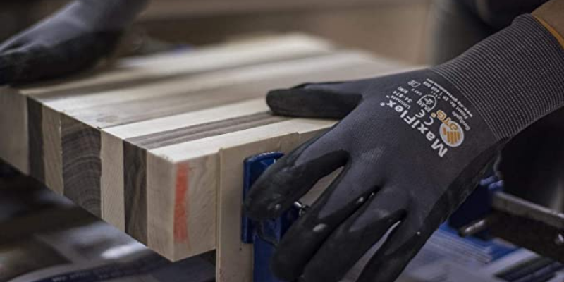 Person using the Maxiflex 34-874 Ultimate Gloves while sanding.