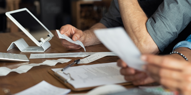 cafe owner working on bookkeeping.  