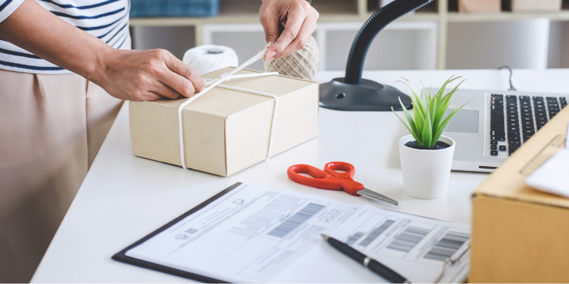 Business owner preparing shipping packages.