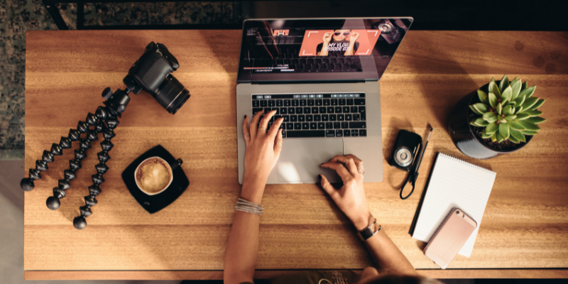 Photographer editing a photo on her laptop.