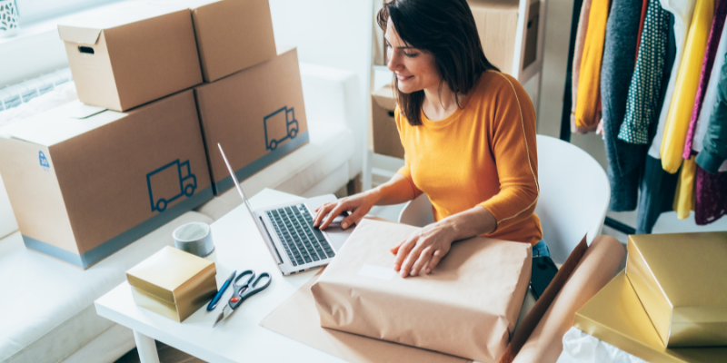 small business owner packaging orders.