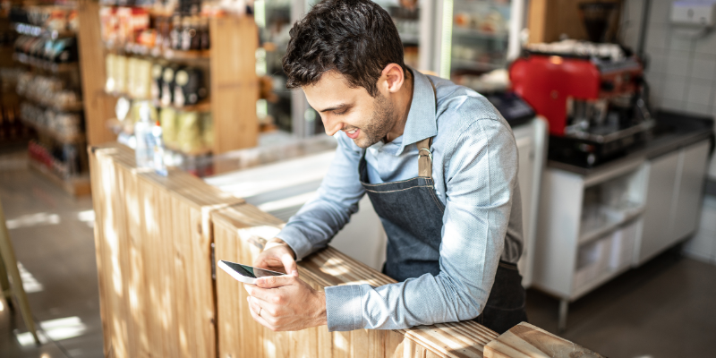Small business owner responding to a client through text.