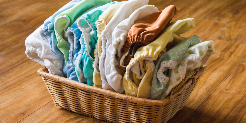 Basket of assorted cloth diapers.