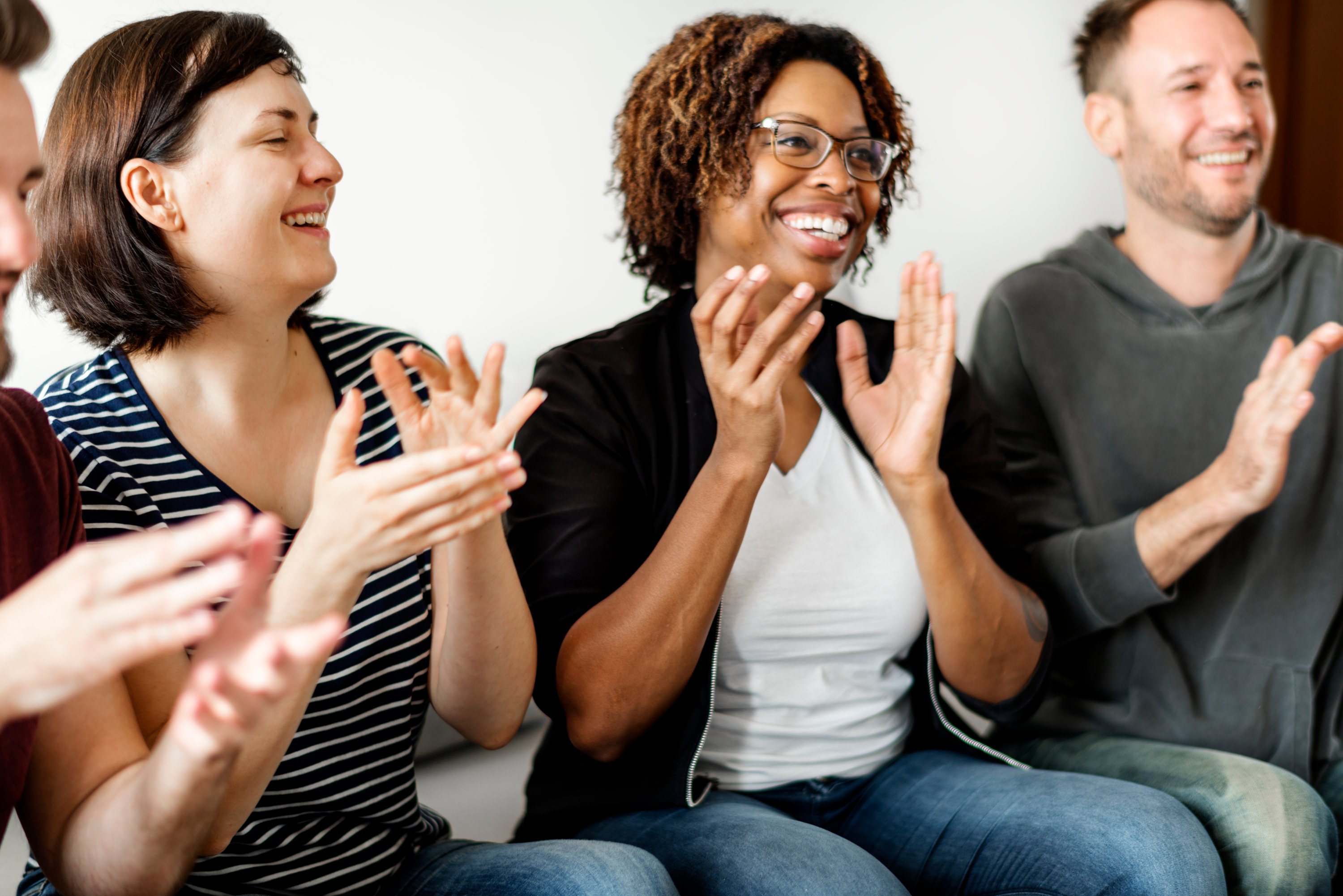 team members clapping. 