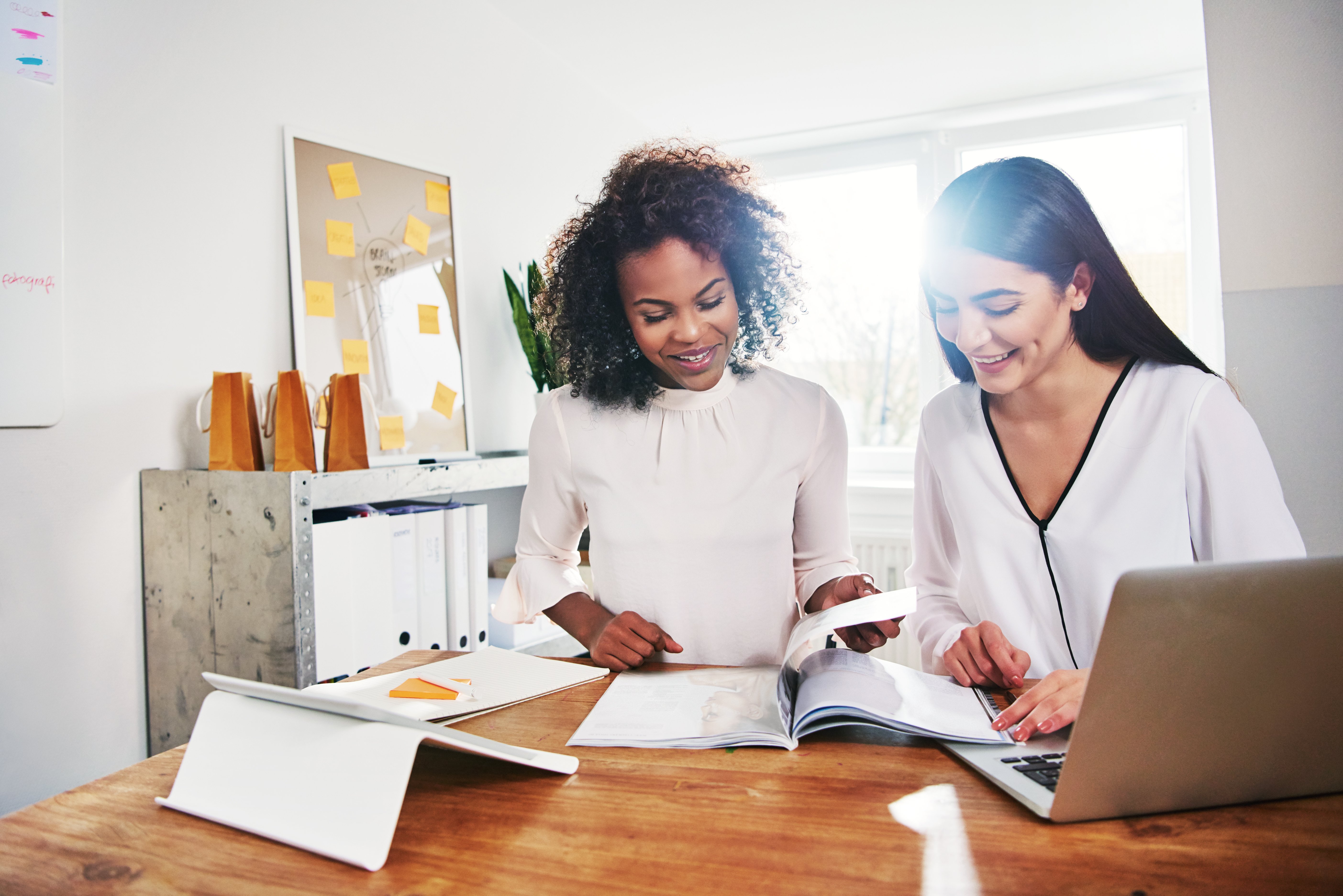 two-happy-young-women-in-business-together-G8QLLL8