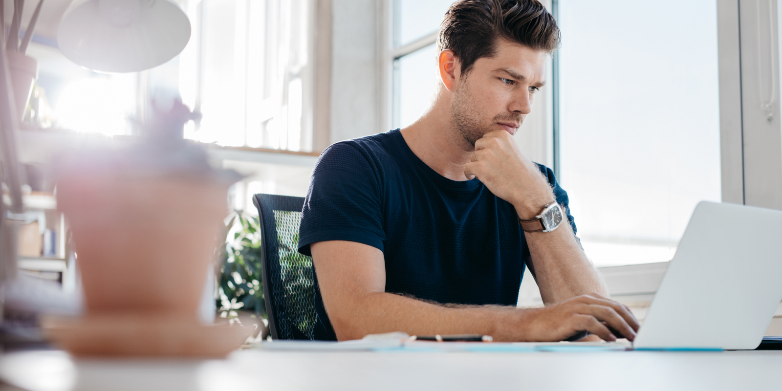 man looking at a computer