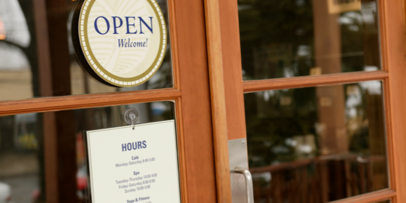 Business storefront with an open sign.