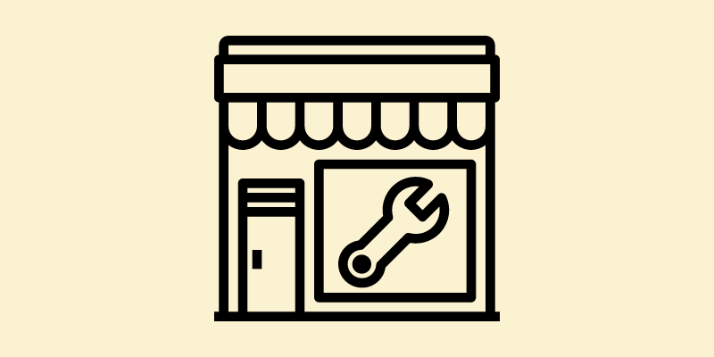 Illustration of a small business with a wrench on the window.