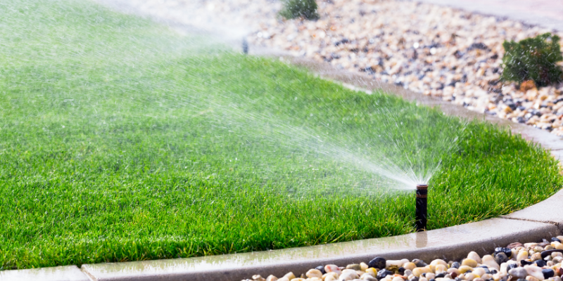 An irrigation system watering a lawn.