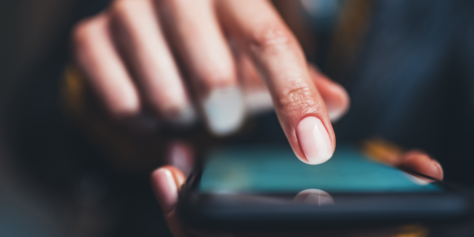 Man pushing button on cell phone