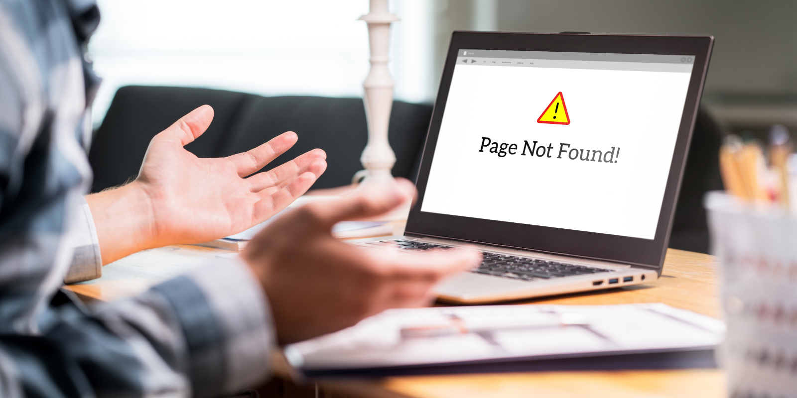 man frustrated at his computer that says "page not found"